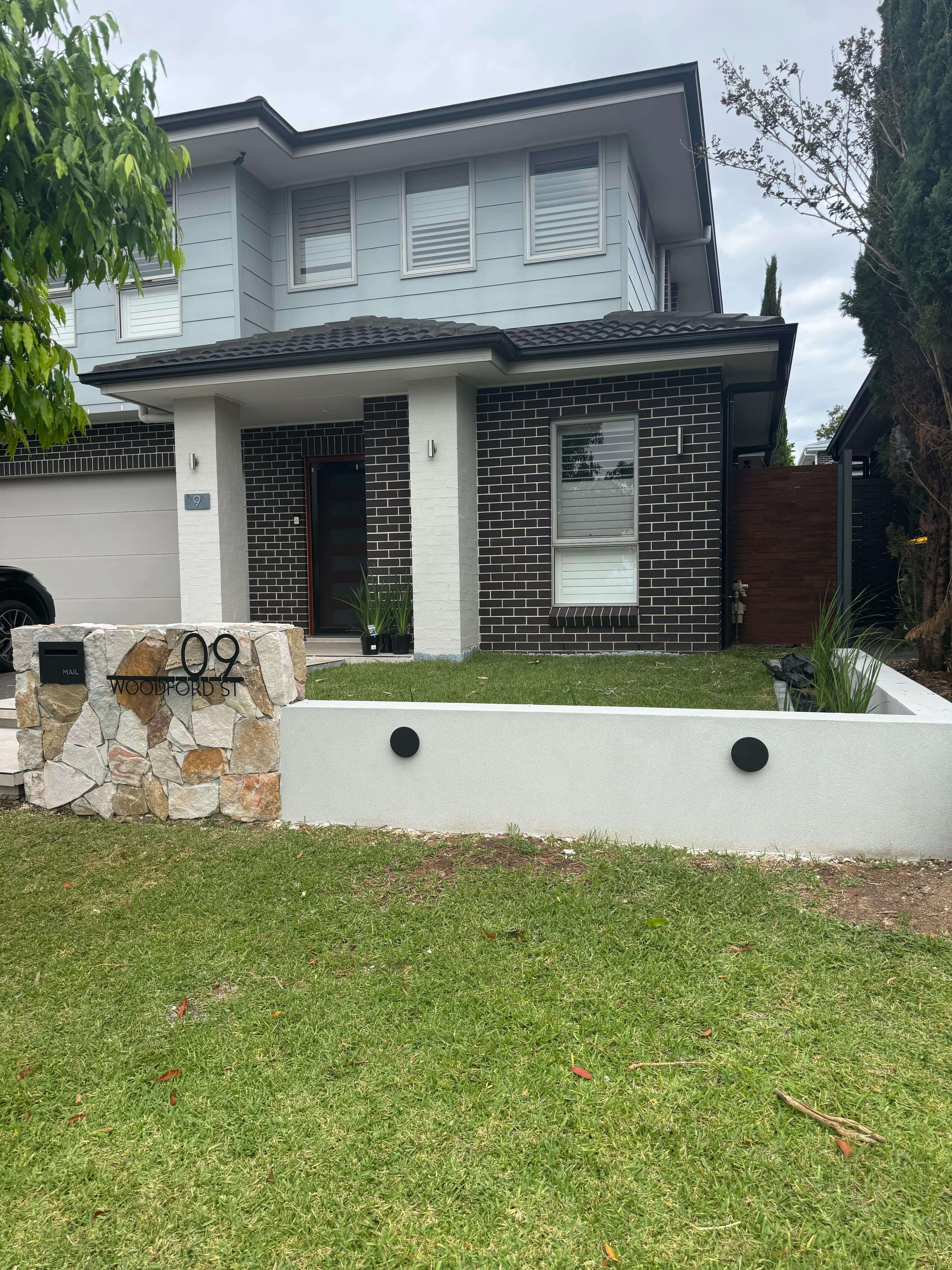 Durable Colorbond fence and retaining wall installation